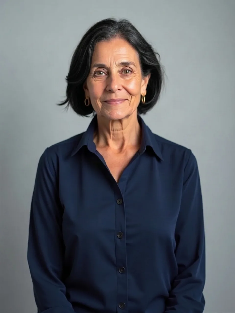 Black hair on a woman in her sixties, bob length unchanged.